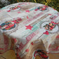 nappe motif père noël sur font écru